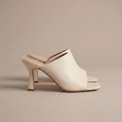 Cream square toe heeled mules, side view
