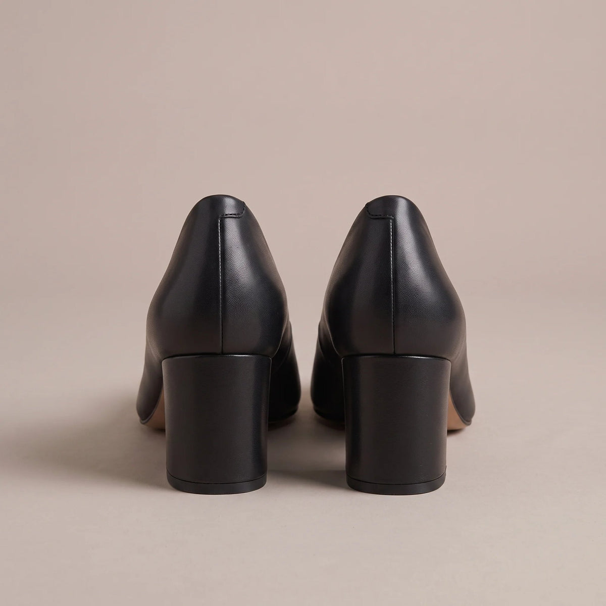 Black block heel court shoes, back view